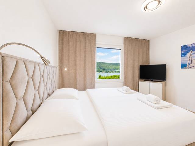 Schlafzimmer – Deluxe Bungalow – Ferienwohnung Wörthersee
