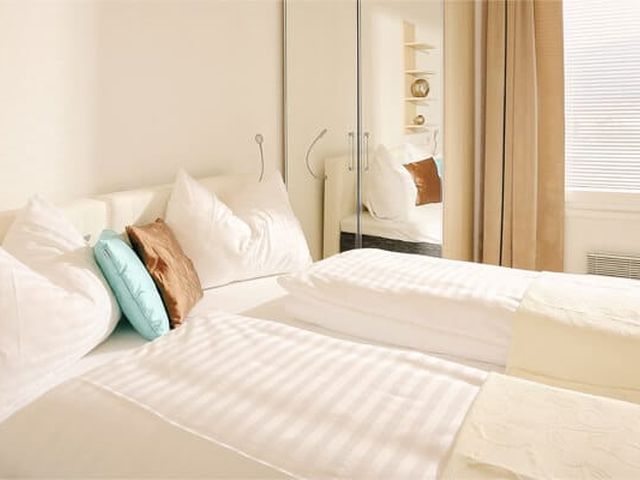 Schlafzimmer – Superior Bungalow – Ferienwohnung Wörthersee